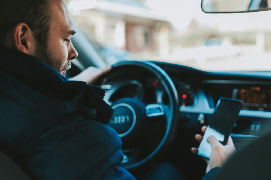 a man use a phone in EV